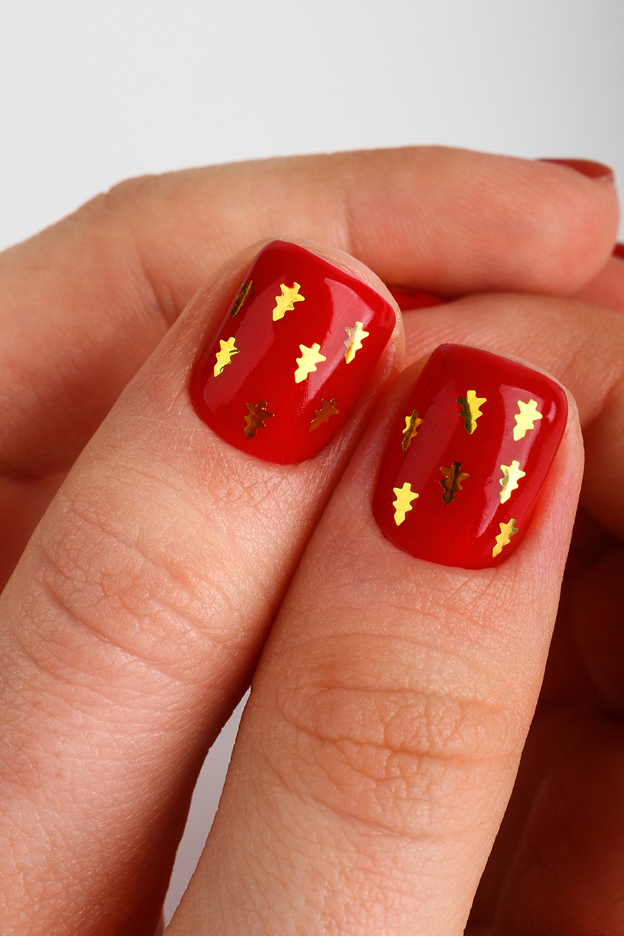 Дизайн ногтей. Товар: RockNail, ELKA - топ с блестящими арт-частицами в форме ёлочек (Golden Lights), 10 мл